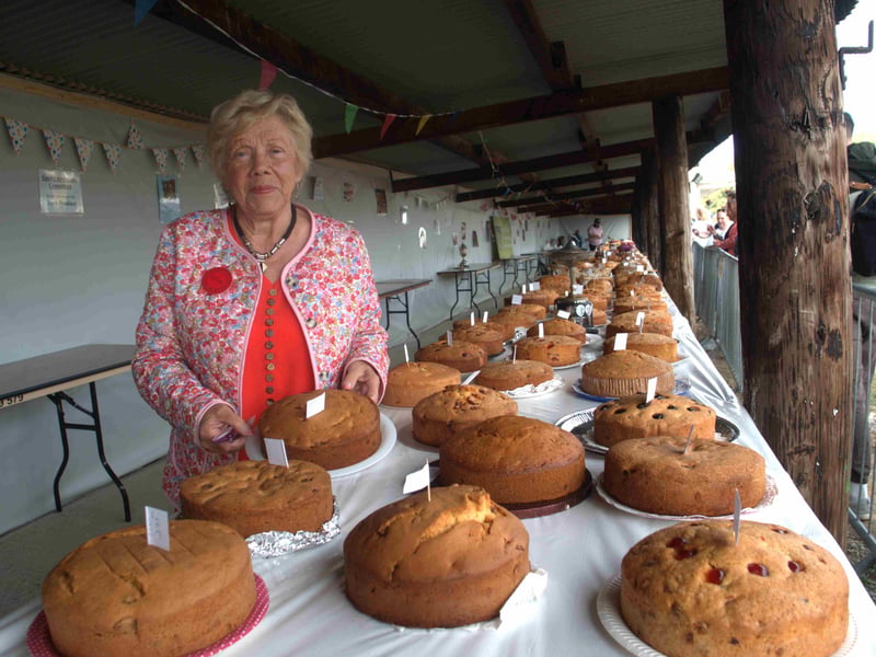 Maura Hogan of the Iverk Show Committee at the showing baking section full of mouth watering cakes 