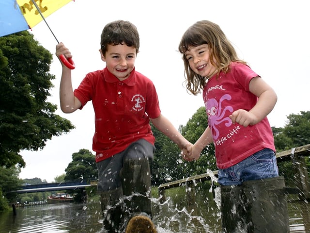 The River Don and the canal merged into one at Sprotbrough Falls thanks to heavy rain. Our picture shows Oliver and Lucy Cawood, aged five, and three, splashing about on the footpath alongside the canal.