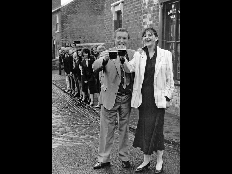 Thirteen new tourism guides celebrate receiving their badges at the Black Country Museum in Dudley in September 1989. Among them was 22-year-old Claire Blewitt from Darlaston, pictured raising a glass with Warley West MP Peter Archer. Six women and seven men earned their badges by demonstrating their knowledge of the area's history and traditions. Do you remember seeing these guides around the Black Country, or recognise Claire?