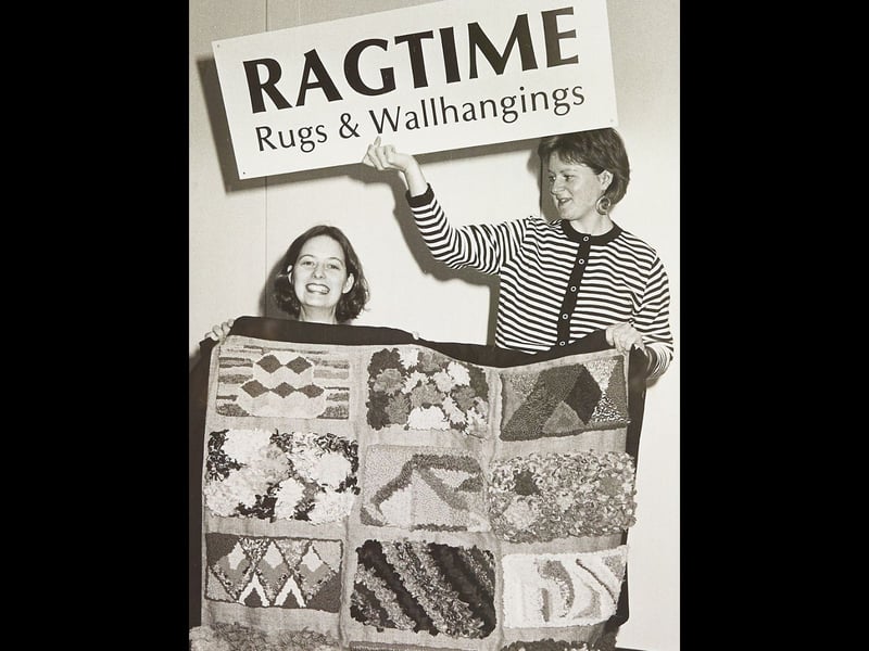 Sophia Wilson and Alison Cox prepare a rug exhibition at Walsall Art Gallery in October 1989, where visitors could also have a go at making their own rag rugs. The hands-on exhibition offered a chance to try a traditional craft for themselves. Have you ever had a go at rag rug-making, or remember this exhibition?