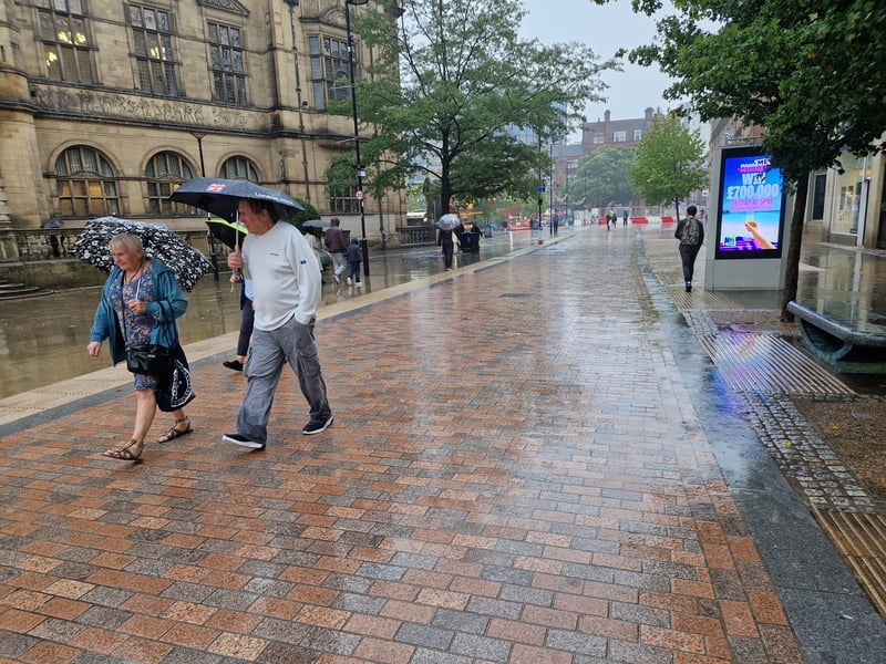Umbrellas out on Pinstone Street, Sheffield as rain sets in following months of dry weather. Photo: Iconic Media
