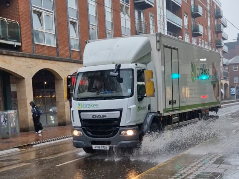 A lorry ploughs through the deep water on West Street, Sheffield. Photo: Iconic Media