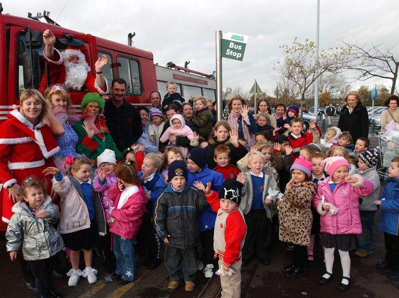 Santa popped in Asda at Christmas in 2003 where firefighters were helping children to get into the festive spirit.