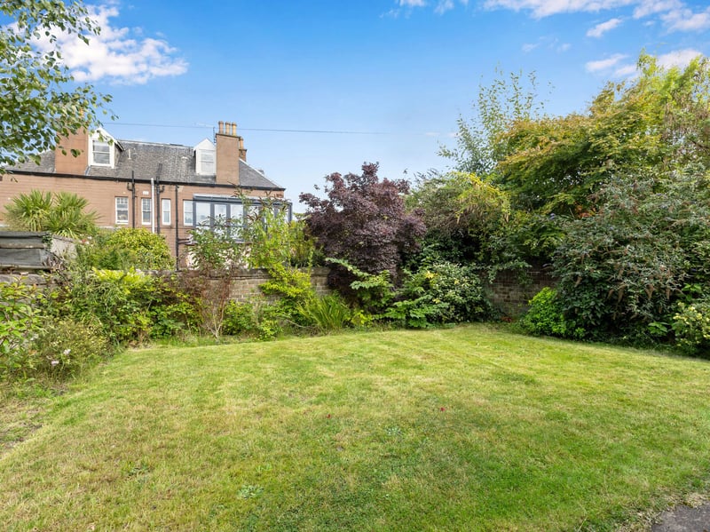 Externally, the property occupies a generous and attractive plot, with a beautifully tended tiered front garden providing excellent kerb appeal. The enclosed rear garden is mainly laid to lawn with a patio area and mature planting, creating a peaceful and private setting for outdoor dining, entertaining and family life.