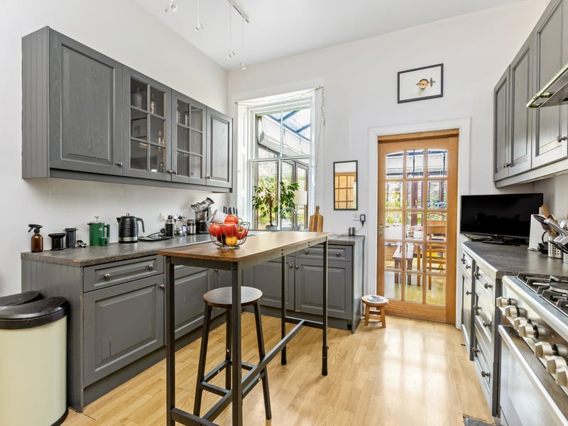 The well-equipped kitchen is fitted with a good range of wall and base units and leads through to a superb conservatory.