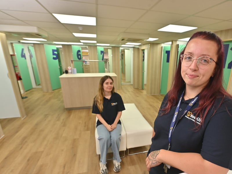 Chloe Williams and Jessie Baggott show off one of the new fitting rooms which run alongside the other accessible fitting rooms.
