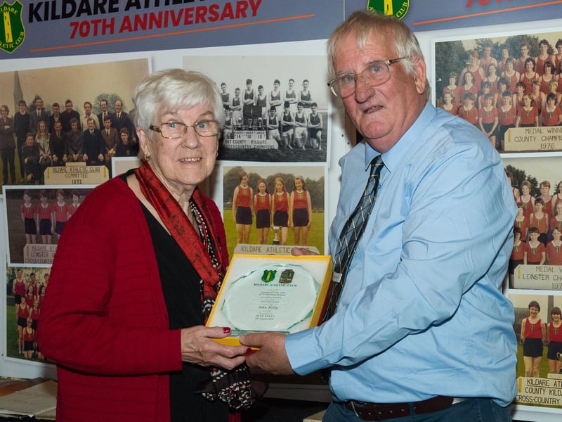 Michael Barber (Secretary) presenting a plaque to Joan Kelly wife of the late John Kelly and founder member of Kildare Athletic Club