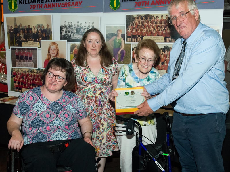 Michael Barber (Secretary) presenting a plaque to Eileen Freeman wife of the late Patrick Freeman and his daughters Rosa Lee and Catriona. Patrick was also a founder member of Kildare Athletic Club