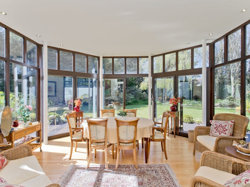 This bright and airy garden room brings the sunshine indoors at this stunning Cramond property, with plenty of space for relaxing.