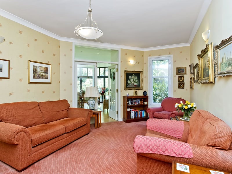While the property's family room provides a comfortable everyday retreat and connects to a distinctive pentagonal garden room.