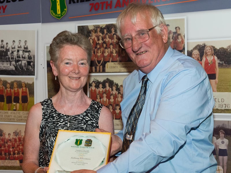 Michael Barber (Secretary) presenting a plaque to Brigid Fitzsimons daughter of the late Anthony Fitzsimons and founder member of Kildare Athletic Club