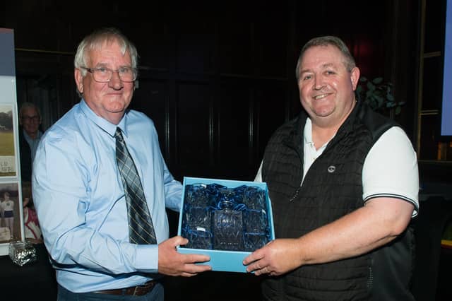 Eamon Kirby (Chairperson of Kildare Athletic Club) presenting Michael Barber (Secretary Kildare Athletic Club) with his award for his outstanding contribution to Kildare Athletic Club