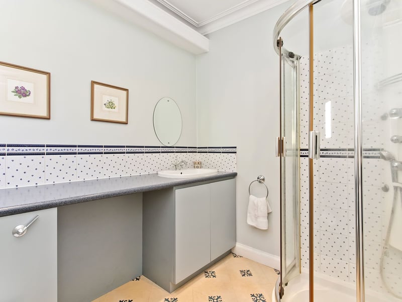 There is also this good sized en-suite shower room serving the principal bedroom, complete with separate shower cubicle.