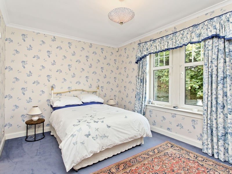 And the property's third bedroom has a further private shower room. Also on this level is a bright pentagonal study, providing an inspiring and unusually tranquil space for reading or working while enjoying elevated views across the surrounding greenery.