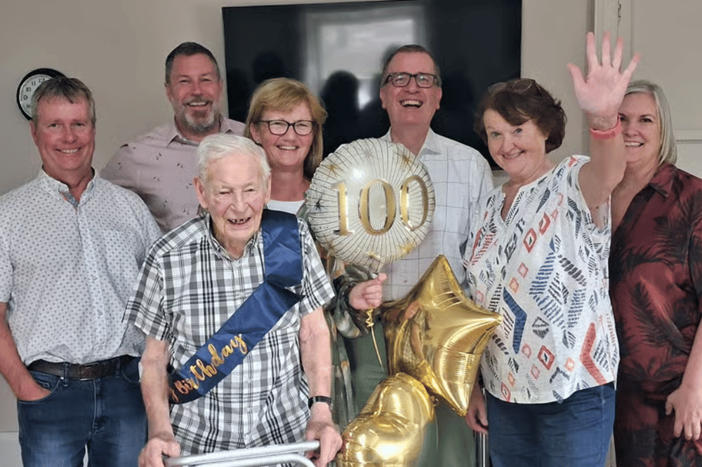 Bob Savage with his family at his 100th birthday celebration. From left, his son Andrew, Doug Drummond, Tanya Barry, his son Christopher, Ute Doerge-Baischew and Melanie Griffith