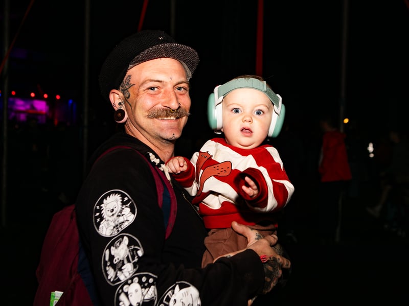 One festival-goer has brought a youngster along to the show