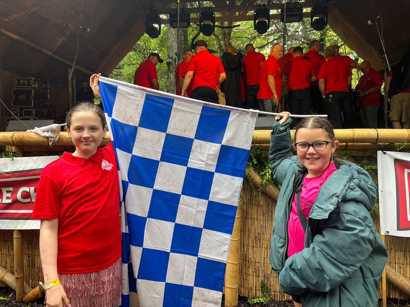 Little supporters ready for the Timahoe Male Choir set on the Survivor Stage at Electric Picnic.