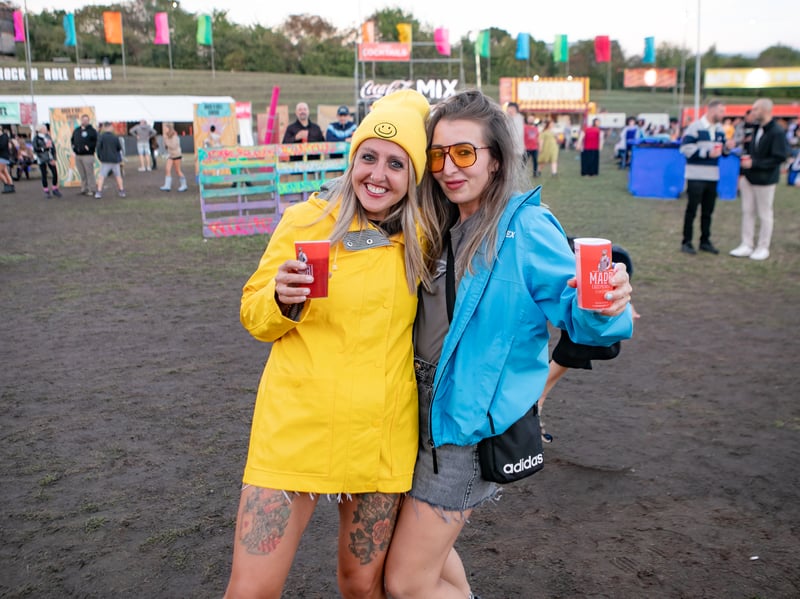 These smiley festival-goers came prepared for the rain