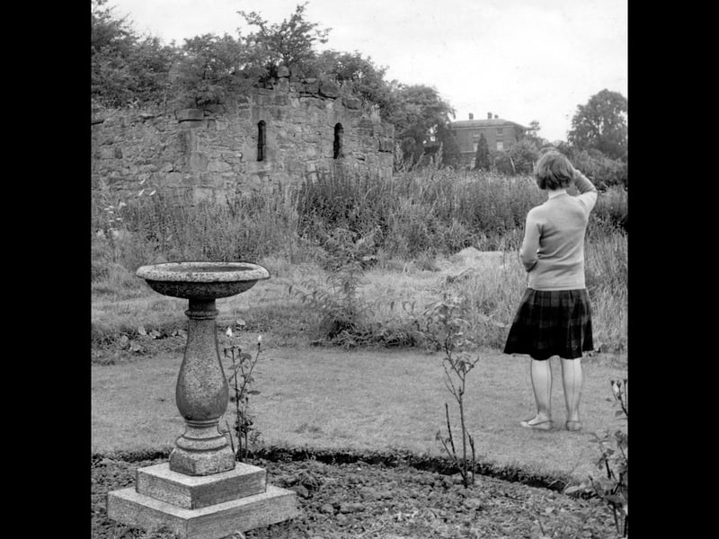 Malinslee Chapel is pictured on August 15, 1962, tucked among the trees with the ruins of the old abbey in the foreground. Standing in the picture is the late Shropshire Star journalist Shirley Tart, who was a young girl at the time. Local legend claimed a secret passage once connected the chapel and Malinslee Hall — could this quiet scene have inspired such stories? Both the chapel and hall disappeared during the development of Telford shopping centre, although the chapel was carefully dismantled stone by stone and later rebuilt at Telford Town Park. Do you remember Malinslee as it looked before Telford was built?