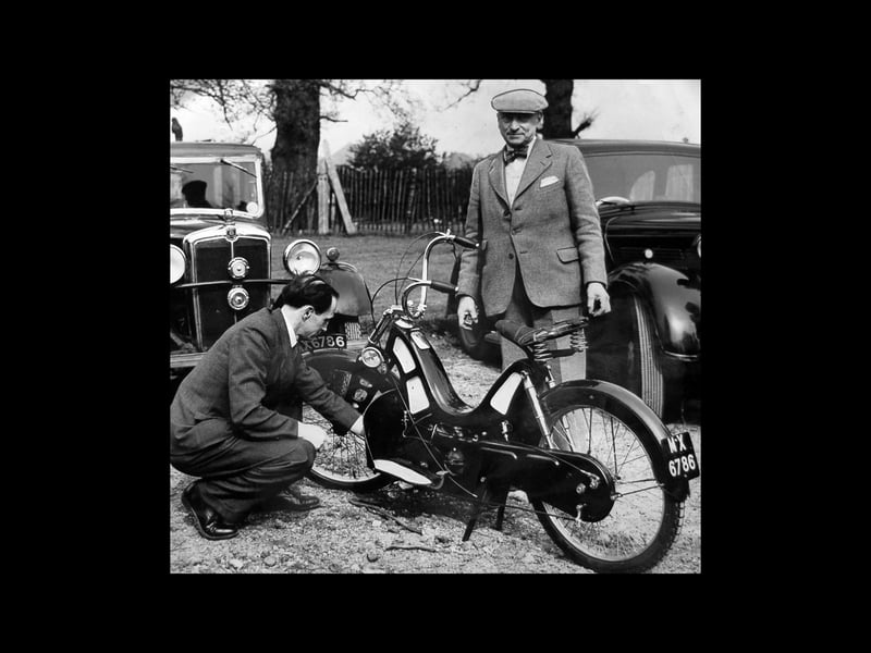 Standing beside a 1920 Ascot-Pulling, which he built himself, is Cyril Pullin. The photo dates from 1953 when the machine was expected to take part in a vintage motorcycle rally that formed part of Stourbridge's coronation programme. It had various features which were ahead of its time - complete enclosure of working parts, scooter-like riding position, all weather protection, and swinging arm rear suspension.