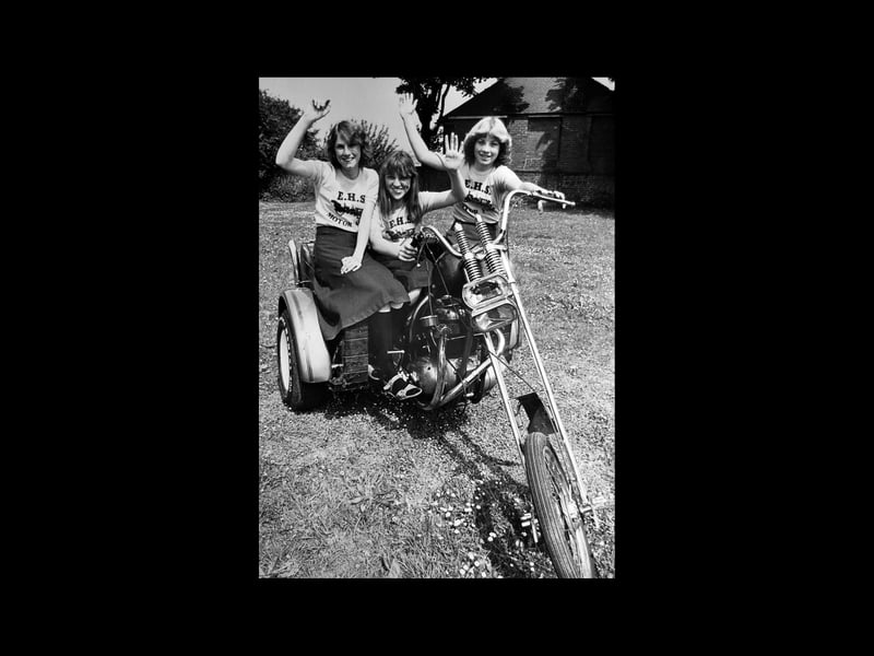 Revving up for their school's motor fair in July 1979 were some of the girls from Earls High School, Halesowen. The original caption has four names - Sara Claridge, Dawn Freeman, Lorna Dibble and Donna Freeman - although there are only three on the picture. Ho-hum, but at least they'll know who they are. They are pictured with a 650cc BSA motor trike, which was one of the attractions on show. Money raised at the event in the school grounds was going towards the school minibus fund.