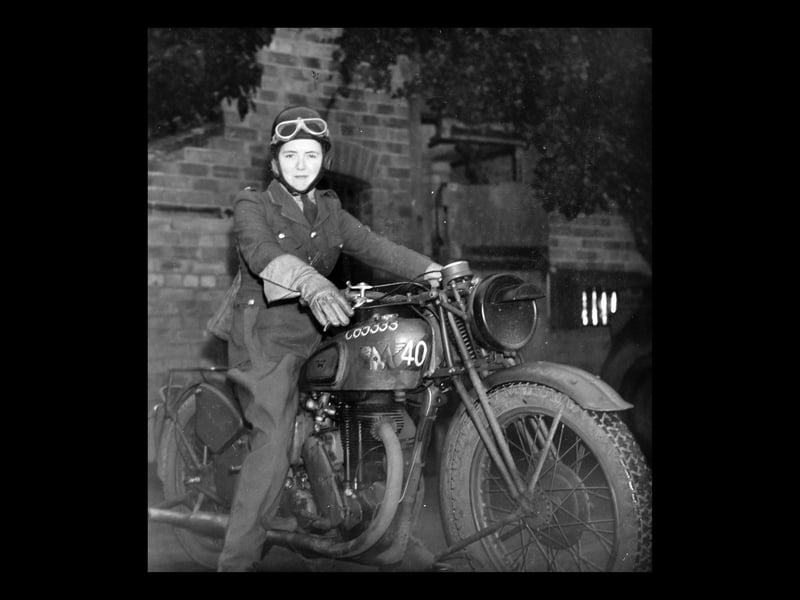 This picture was carried in the Express & Star of November 28, 1941, with a caption which said: "Eighteen year old Felice (no surname was given) gets a real kick out of Army life as a motorcycle dispatch rider in a West Midland Anti Aircraft Motor Transport Company, ATS. (n.b. ATS stands for Auxiliary Territorial Service). In crash helmet, slacks, weatherproof leggings and jerkin and muffler, Felice, former nursemaid from the south, can be seen most days motorcycling with dispatches. When I talked with her at her billet in a former old manor house she told me that she had never ridden a motorcycle before she volunteered. Now Felice not only rides a motorcycle, but she has to maintain it in running order..." It turned out that her full name was Felice Dowden, and she was an evacuee from Jersey. Sadly here career as a dispatch rider was ended by a serious accident. Shortly after the war she married Arthur Waterman and had four children, living in the Portsmouth area.