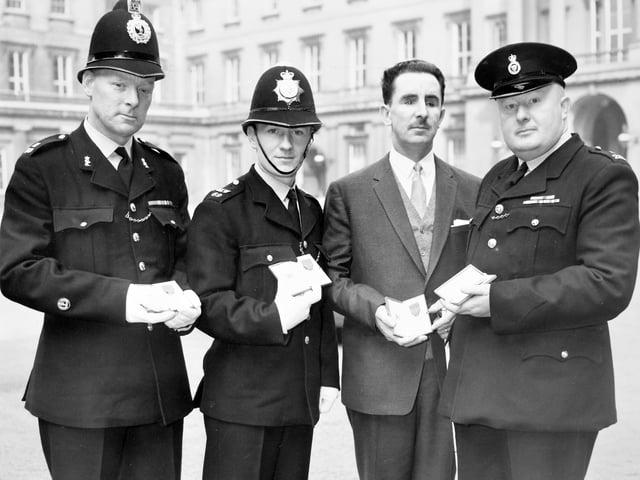 Constable Bob Roberts (right) of Shropshire Constabulary is pictured outside Buckingham Palace on March 6, 1962, after receiving the George Medal from the Queen. He was one of four police officers invested with the medal that day, alongside officers from Liverpool City Police, Mid Wales Constabulary and Gwynedd Constabulary. The ceremony followed acts of outstanding bravery, including the actions of Constable Arthur Rowlands, who was blinded after being shot in the face while on duty in August 1961. Can you remember Constable Roberts or his George Medal being awarded? Do you have memories of this remarkable story?