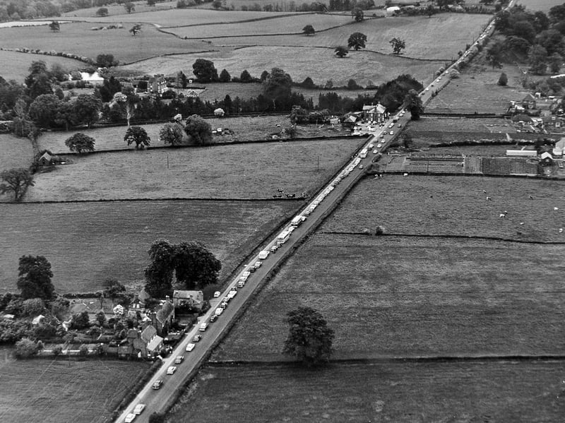 This aerial view of the A5 just north of Shrewsbury captures the long journey home on Whit Monday, June 11, 1962. Photographer Bob Craig recorded traffic nose to tail as motorists approached the Shelton junction, with the homeward rush at one point stretching for around six miles from Meole Brace towards Montford Bridge and Ford. It is a striking reminder that holiday traffic jams are nothing new. Can you remember getting caught in traffic on the A5? How long did your journeys home take in those days?