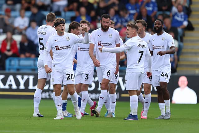 Logan Briggs celebrates after scoring against Gillingham
