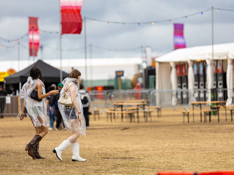 Crowds enter the festival at the start of day 3.