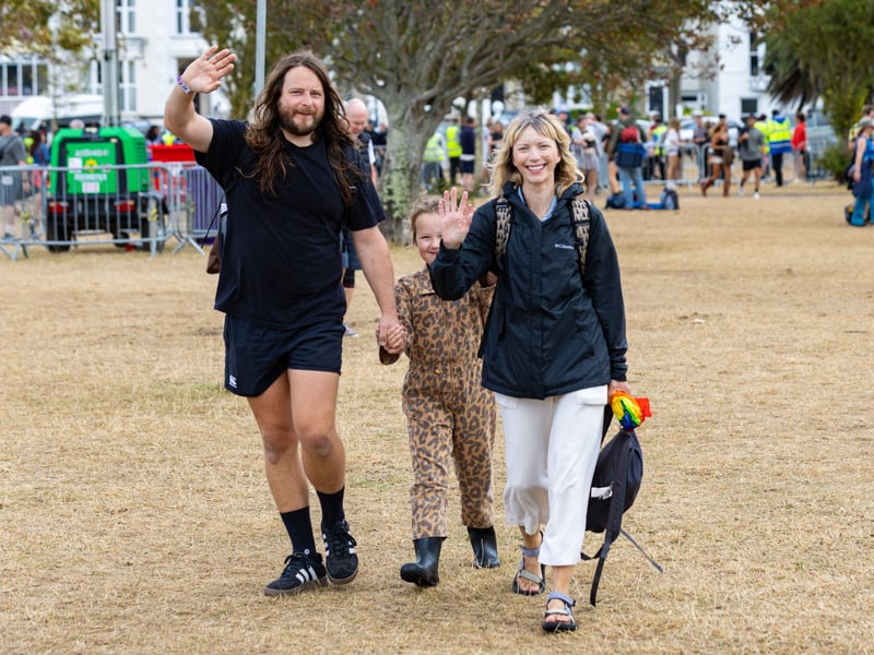 Exited music fans enter the festival for day 3.