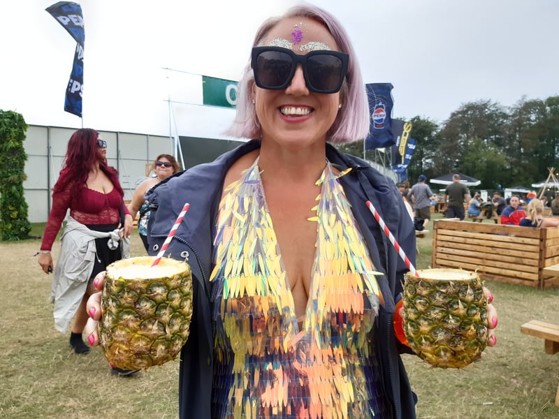 This wonderfully dressed festivalgoer was enjoying some drinks from inside pineapples! Have you ever used a fruit as a drinks' glass?
