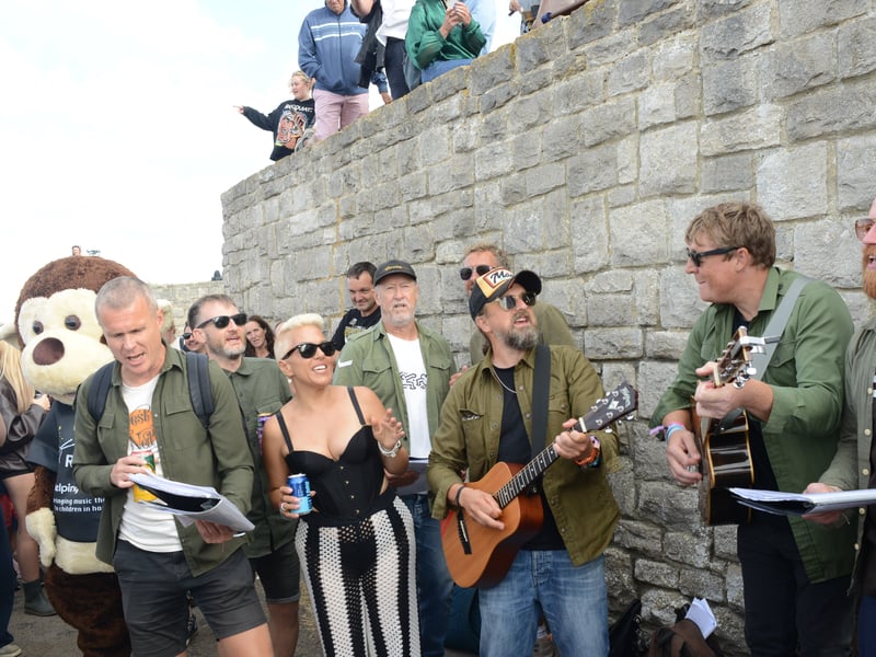 Southsea Alternative Choir at Victorius 2026  busking on the hill.