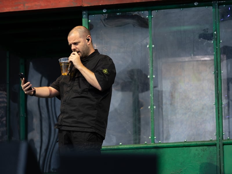 Mike Skinner put on a theatrical performance with the stage kitted out with the bus shelter from the front cover of his 2004 album 'A Grand Don't Come For Free'.