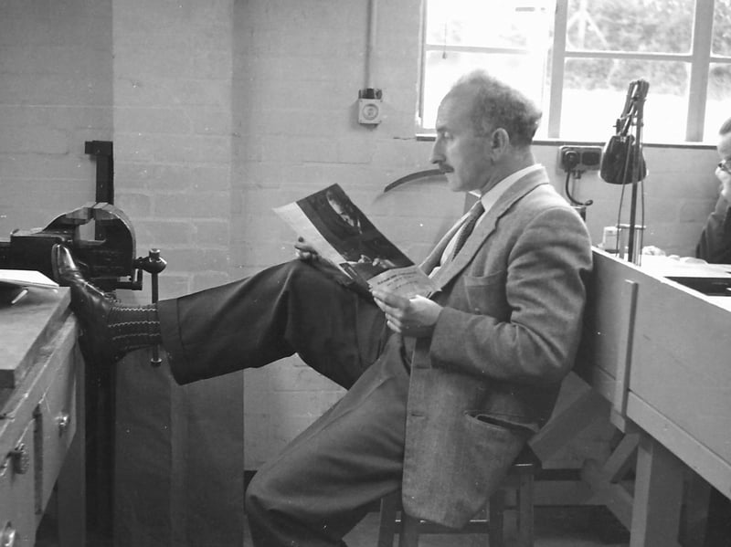 Take a break, put your feet up, and grab something to read. But what is it that Arthur Harris is perusing? And that's quite a beefy vice on the bench. Arthur lived in Buildwas Road, Ironbridge, and was a cousin of Roy Harris. Nice socks, by the way.