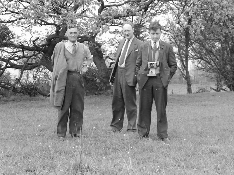 This trio was relaxing outside. The jacket could come off, but the ties definitely stayed on.