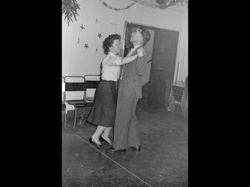 Either something's caught his attention on the ceiling, or he's looking for the mistletoe. The notice on the wall in the background is a bit incongruous. It's something to do with Wellington Town FC, which would become Telford United a few years later.