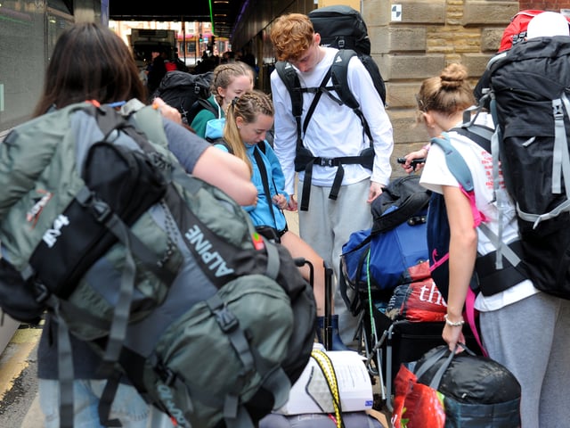 A loaded shuttle bus is unpacked