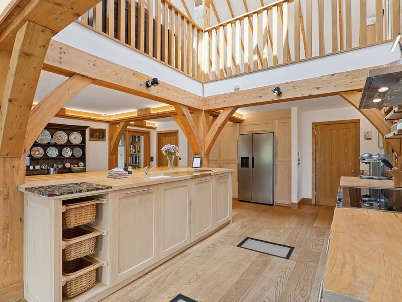 The property has been designed to combine traditional materials, including stone, larch cladding and oak beams, with contemporary living spaces and extensive views across the loch.