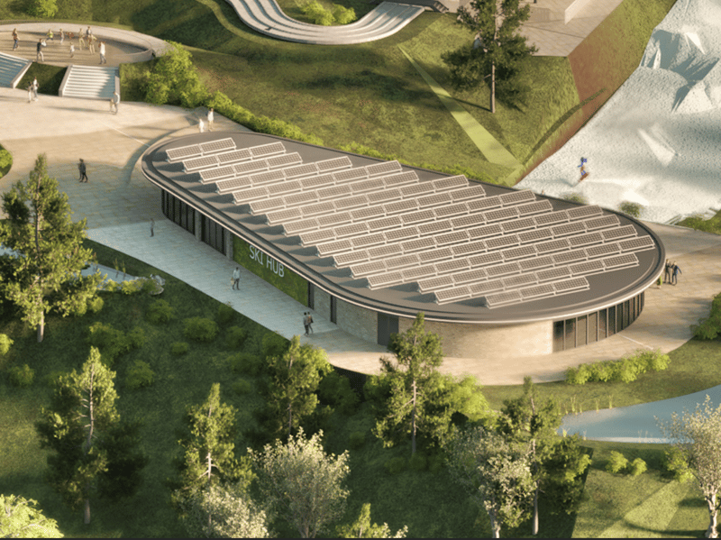 A centre at the base of the ski slope with solar panels. A small pond is also visible to the right.