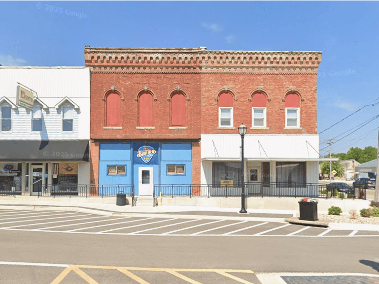  This small village has a population of around 821 people. It has an interesting history with a legendary “coin toss”, which states the founders flipped a coin to decide which of their names the town would carry. 

The winner of the coin toss happened to be Joseph E. Sheffield, an American business leader and philanthropist. 
