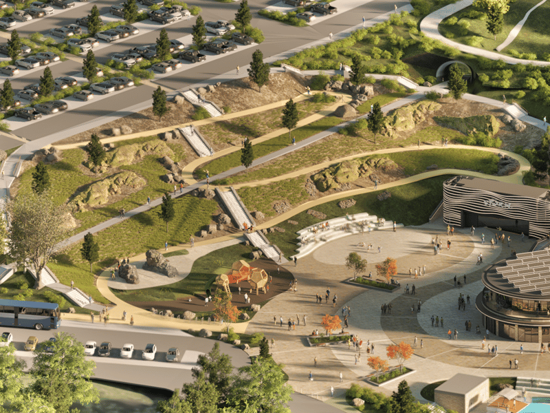 The central plaza features stairs and ramps leading down from the car park.