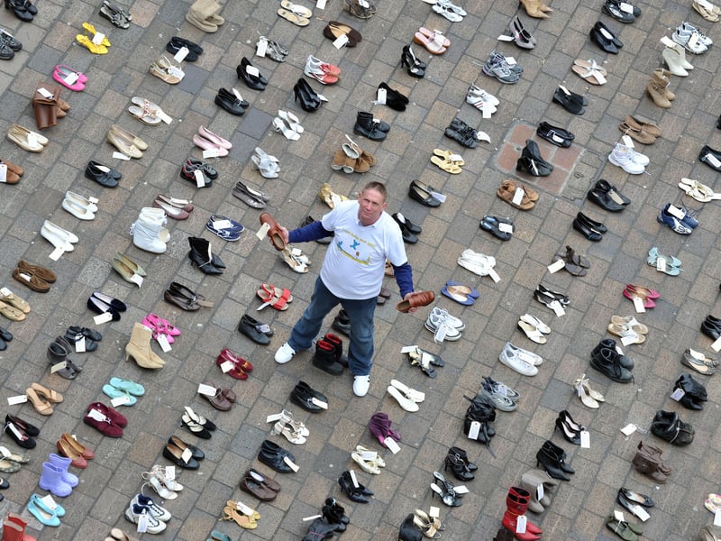 Alan Knight with 325 pairs of shoes which represent those people who are lost to smoking related illness in Portsmouth alone each year. Reformed smoker Knight lent his support to the Pompey Quit campaign in 2012 which aims to prevent further deaths.
Picture: Steve Reid (120910-038)
