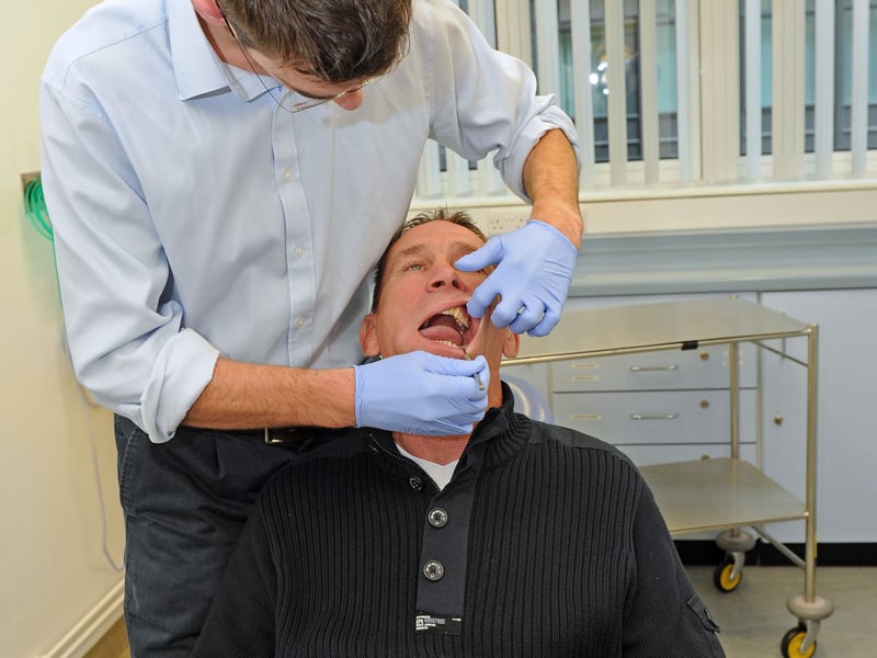 Alan Knight is supporting Mouth Cancer awareness month. Alan was at Queen Alexandra Hospital on Wednesday 16th November 2011 to have a mouth check by Tom Aldridge, specialist registrar.
Picture: Sarah Standing (114083-205)