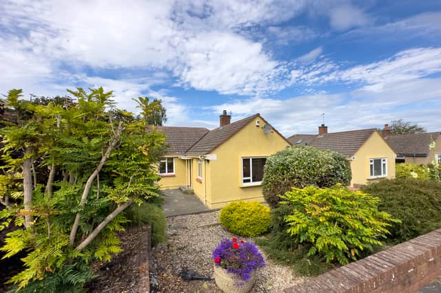 This is a desirable three-bedroom semi-detached bungalow with private gardens, driveway and a garage.