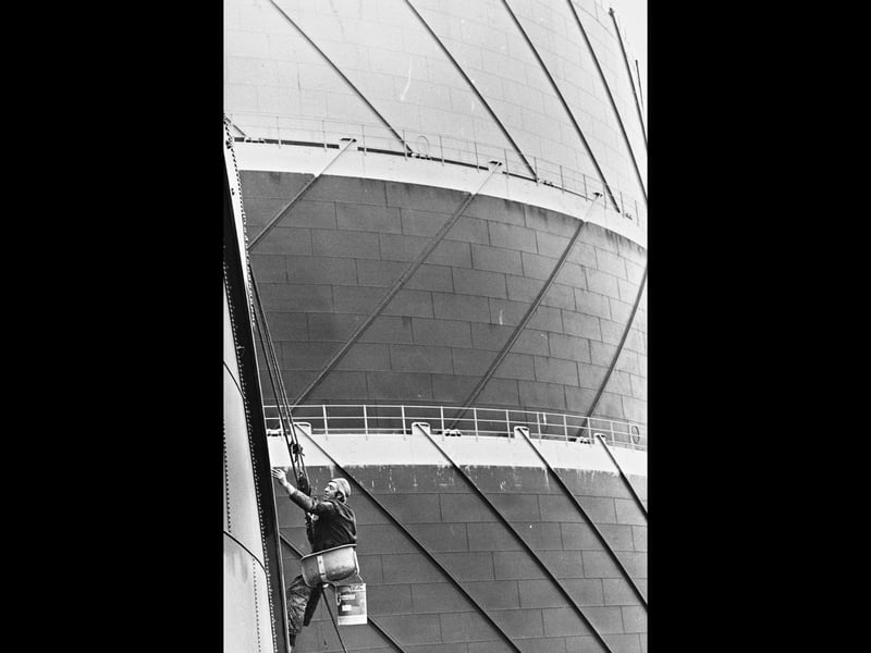 John Campbell and the team from H. Bagnall and Sons of Wombourne faced a rather larger-than-average painting job in July 1988 — covering the 20,000 sq ft surface of the James Bridge gas-holders beside the M6 at Walsall. Around 2,000 gallons of paint were expected to be used on the job. John, from Wednesbury, had already spent 27 years painting large structures, including the BL Mini factory at Longbridge, which took two years to complete. He is pictured at work on the gas-holders. Do you remember seeing the James Bridge gas-holders being painted? Did you or someone you know work for H Bagnall and Sons or in the painting trade?