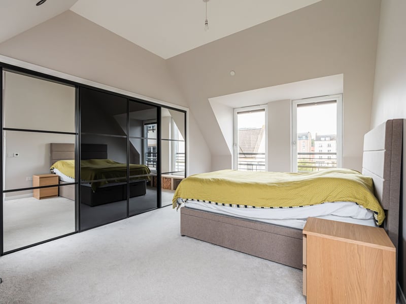 The dual-aspect principal bedroom enjoys an impressive open outlook and benefits from fitted wardrobes.