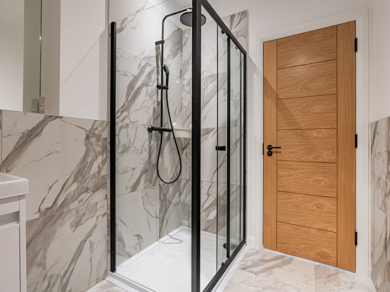 The Bellevue property's principal bedroom also benefits from this contemporary en-suite shower room. 