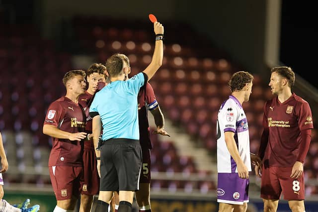 Referee Alan Dale shows Lee Evans a red card