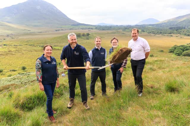 Minister of State, Christopher O’Sullivan turning the sod on the new trails at Connemara National Park, with Rachel McHugh, Eugene Finnerty, Denis Strong and Michael Fitzsimons, all from the NPWS.
